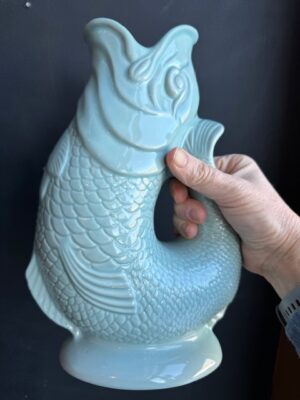 Gluggle Jug XL in Eau De Nil being held by a hand