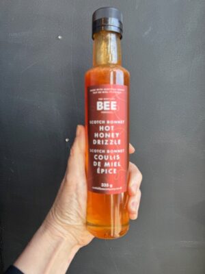 a bottle of Scottish Bee Scotch Bonnet hot Honey drizzle