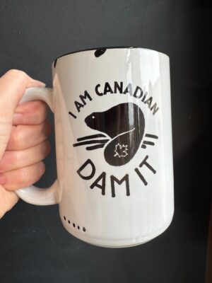 Prairie Chick Mug in white with a beaver on it and 'I am Canadian, Dam it"