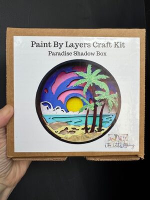 Shadow Box painting kit called Paradise featuring a sunset beach and palm trees