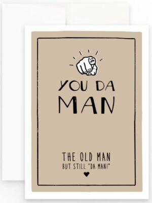 Prairie Chick Card with brown background and a pointing finger. Text reads "You Da Man. The old man, but still da man."