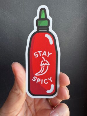 Vinyl sticker a red jar of hot sauce with text 'stay spicy'