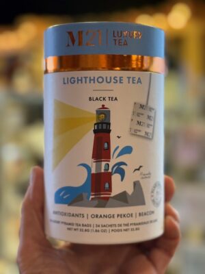 M21 Lighthouse orange pekoe tea in a white paper tin