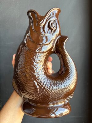 Cocoa Bean brown XL Gluggle Jug in front of a black wall