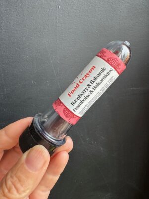 Raspberry & Balsamic Food crayon in front of a black background