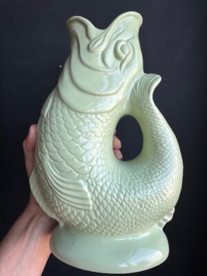 Pistachio XL Gluggle Jug in front of a black wall