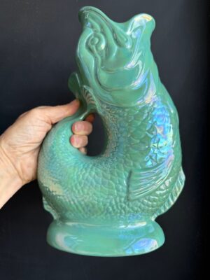 Sea Green Lustre XL Gluggle Jug in front of a black wall