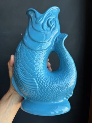 Turquoise XL Gluggle Jug in front of a black wall