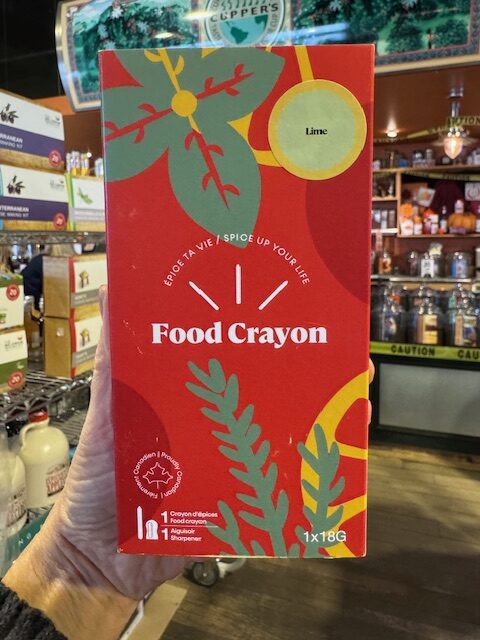 Food crayon gift box, one lime crayon and a sharpener in bright red box