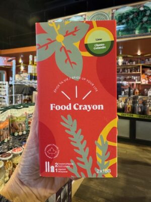 Food crayon gift box, with one lime crayon and one cilantro crayon and a sharpener in bright red box