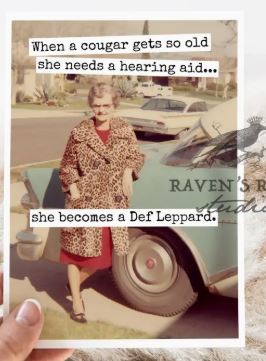 Raven's Rest Studio Greeting Card - "When a cougar gets so old she needs a hearing aid... she becomes a Def Lepperd." Vintage lady in a leopard coat, leaning against a blue car.