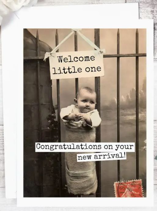 Raven's Rest Studio Greeting Card - "Welcome little one. Congratulations on your new arrival!" Baby in a carrier hanging on a wrought iron fence.