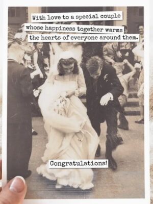 Raven's Rest Studio Greeting Card - "With love to a special couple whose happiness together warms the hearts of everyone around them. Congratulations." Wedding card with bride and groom ducking as rice is thrown at them.