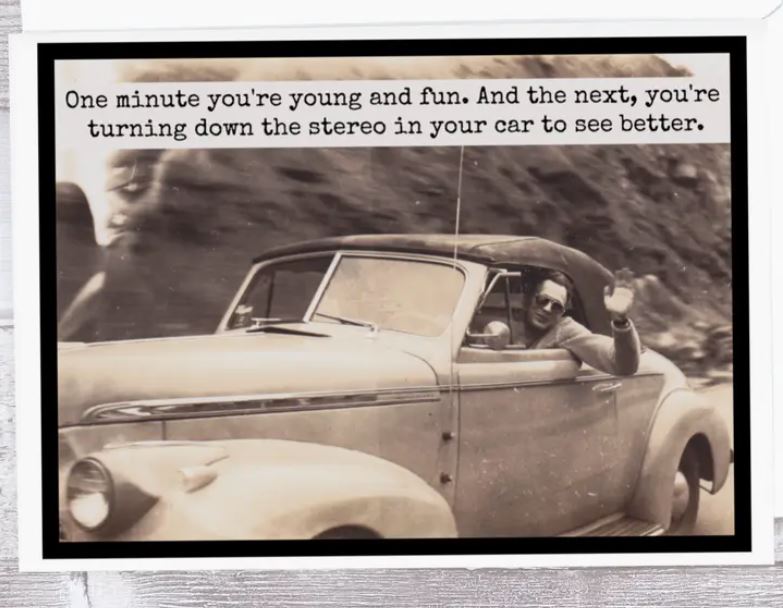Raven's Rest Studio Greeting Card - "One minute you're young and fun. And the next, you're turning down the stereo in your car to see better." Man waving out the window of a vintage car as it speeds past.