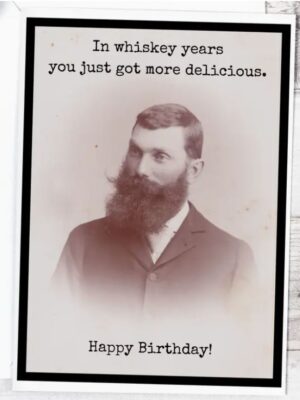 Raven's Rest Studio Greeting Card - 'In whiskey years, you just got more delicious.' Birthday card. Portrait bust of a gentleman with large beard and moustache.