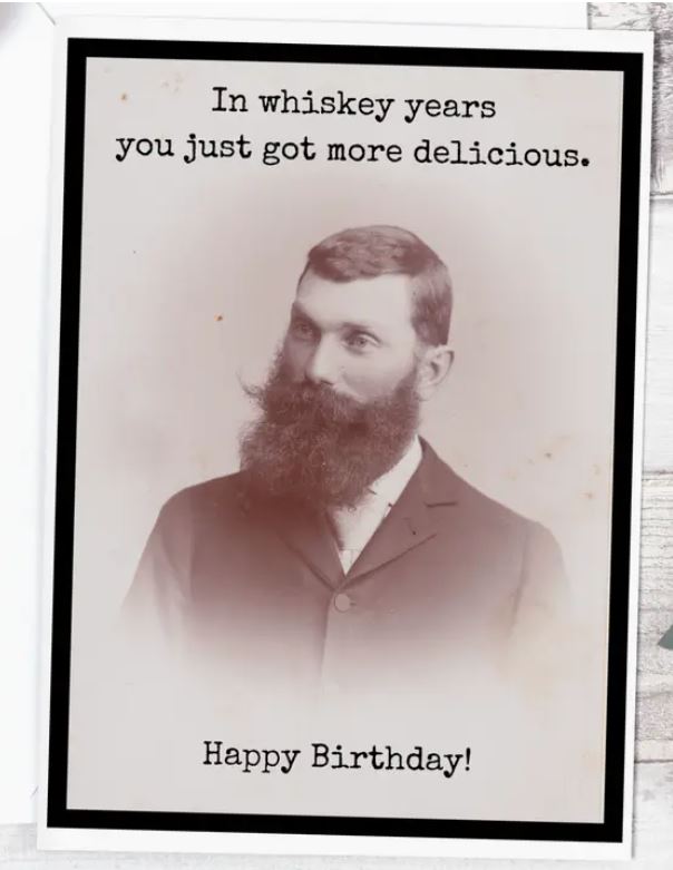 Raven's Rest Studio Greeting Card - 'In whiskey years, you just got more delicious.' Birthday card. Portrait bust of a gentleman with large beard and moustache.