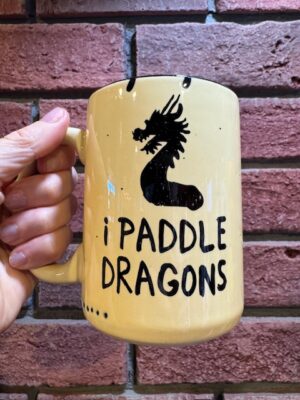 Prairie Chick Mugs Dragon Boat - "I paddle Dragons" in yellow