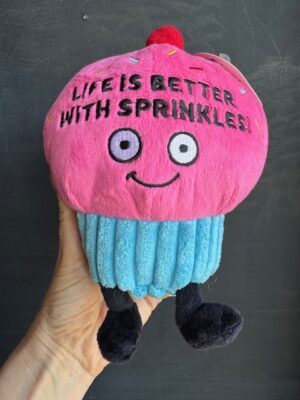 Punchkins stuffie of a blue and pink cupcake, cherry on top, and words 'life is better with sprinkles.