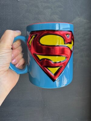 Blue mug with Superman's chest logo with S in metallic red.