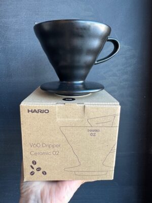Hario V60 ceramic coffee pourover in Matte Black, on its box
