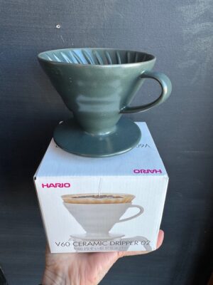 Hario V60 ceramic coffee pourover in Juniper Green, on its box