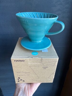 Hario V60 ceramic coffee pourover in Turquoise, on its box