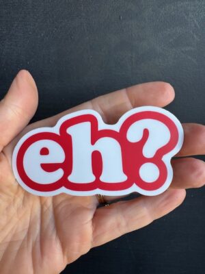Sticker with large white letters on red background "eh?"