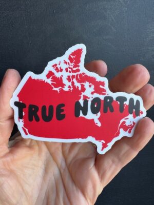 Vinyl sticker with red map of Canada, and black text on it "True North"