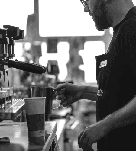 Mickey making a latte