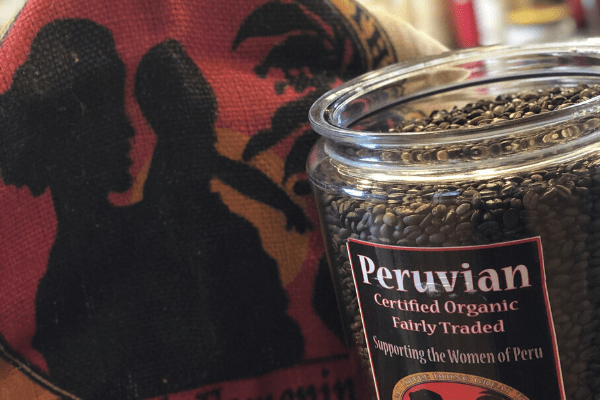coffee roaster Canada Peru Femenino coffee in a burlap bag, and a jar of roasted coffee