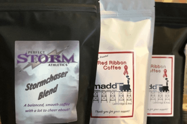 coffee roasters supporting community programs Fundraising black and white coffee bags