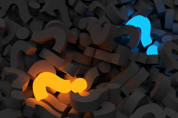 pile of black foam question marks with one illuminated yellow question mark and one blue illuminated question mark